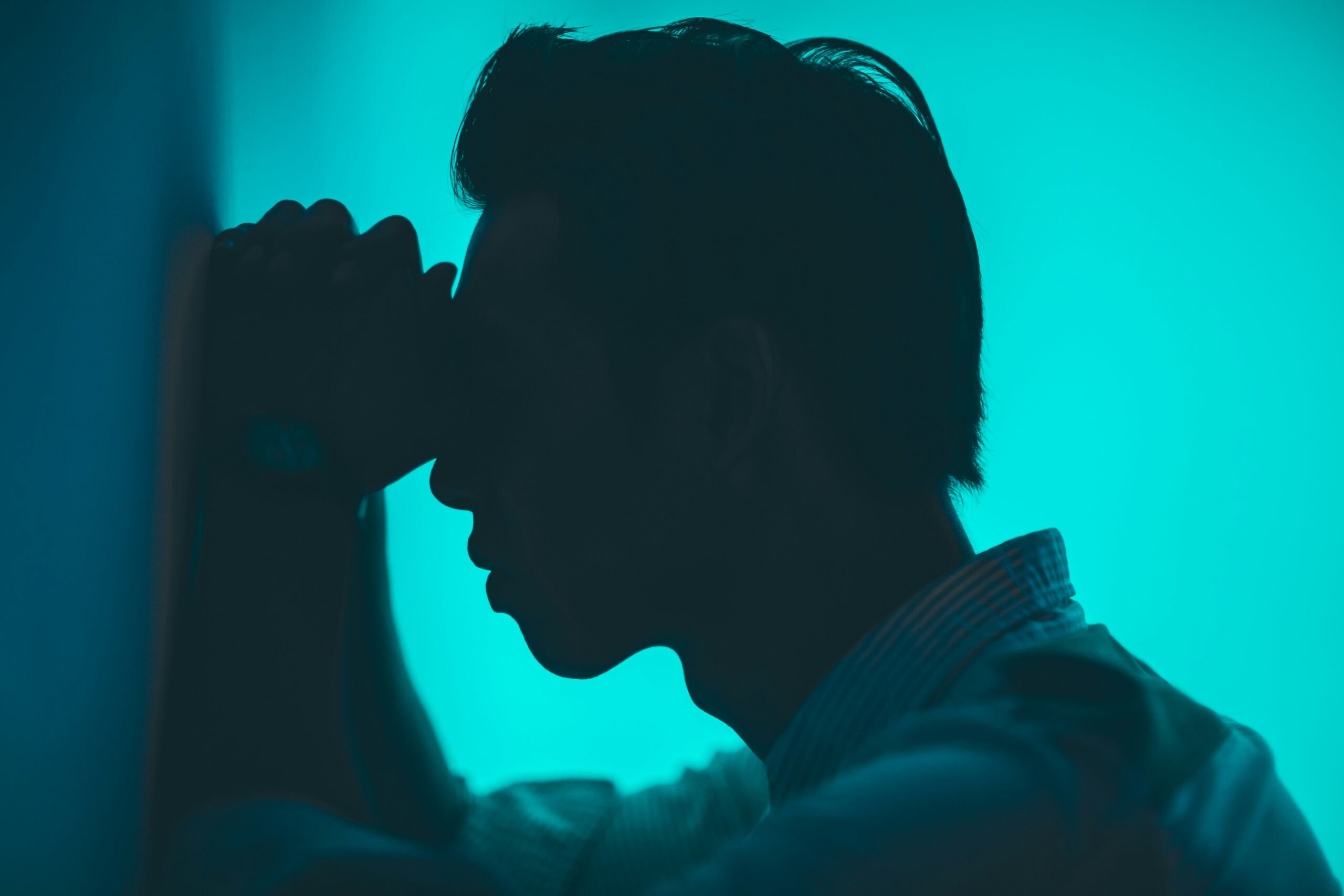 man outline in blue light room